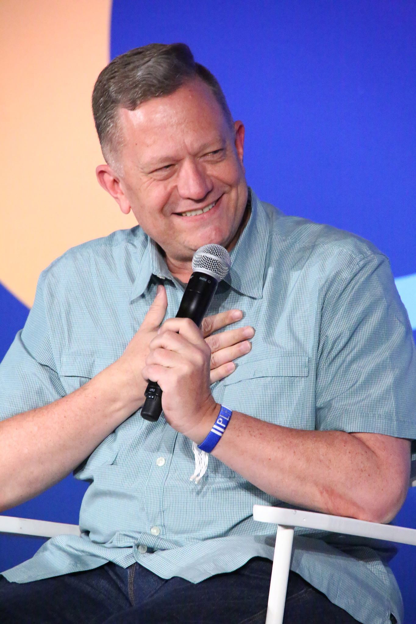 Craig Peterson speaking on stage